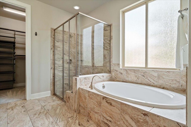 4211 Front Range Ln, Austin, TX 78732 - full bathroom with marble finish floor, a bath, a stall shower, and a walk in closet