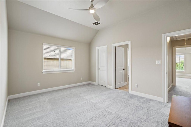 4211 Front Range Ln, Austin, TX 78732 - unfurnished bedroom with attic access, baseboards, vaulted ceiling, and light carpet