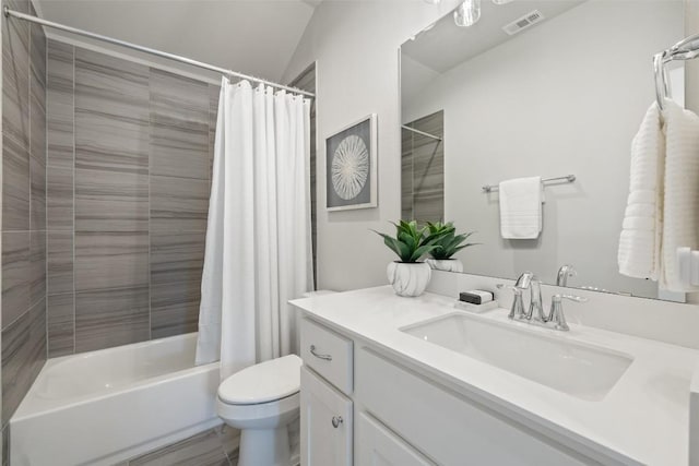 full bathroom with vanity, shower / tub combo with curtain, toilet, and visible vents