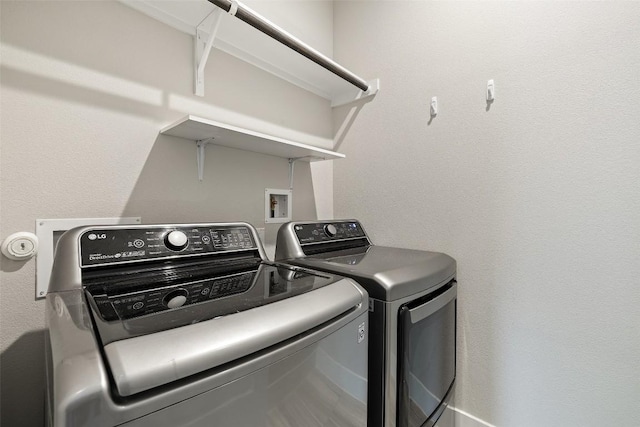 laundry area with independent washer and dryer and laundry area