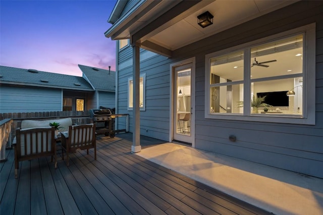 wooden terrace with a grill
