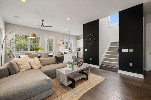 living area with visible vents, recessed lighting, stairs, and ceiling fan