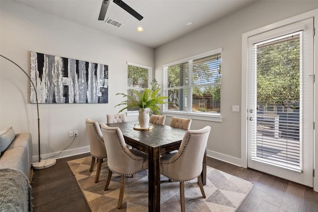 dining area with ceiling fan, visible vents, baseboards, and wood finished floors