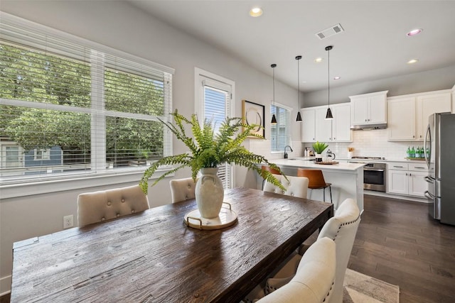 dining room featuring dark wood-type flooring, recessed lighting, and visible vents