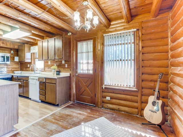 kitchen with light wood-style flooring, a sink, light countertops, wooden ceiling, and dishwasher