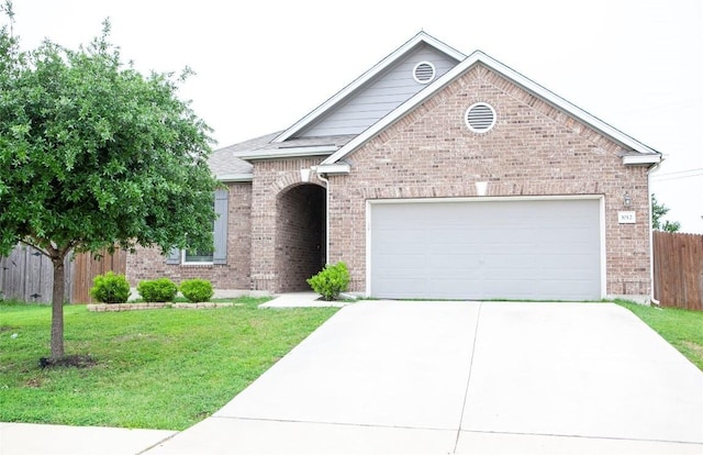single story home featuring a front lawn, a garage, driveway, brick siding, and fence