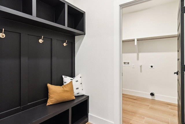 mudroom featuring light wood-type flooring and baseboards