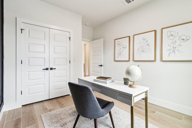 office space with visible vents and light wood-type flooring