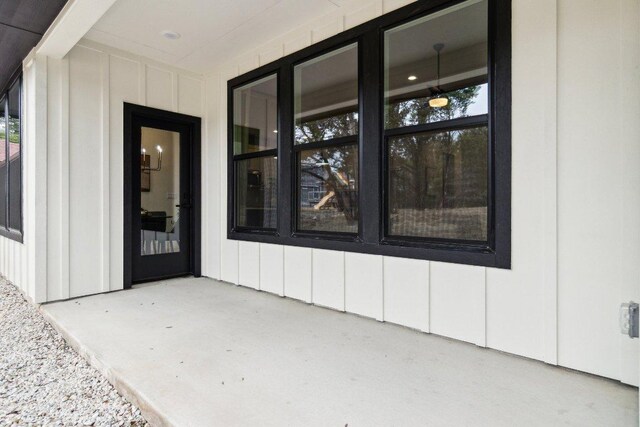view of exterior entry with board and batten siding