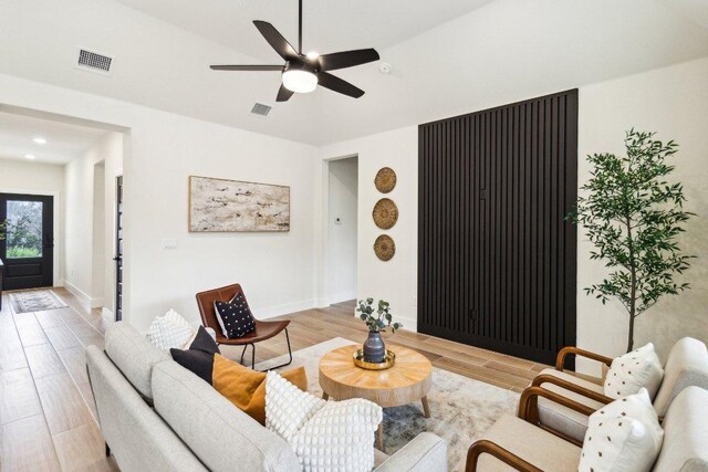 1313 Green Meadow Ln, Spring Branch, TX 78070 - living room with light wood-style flooring, ceiling fan, baseboards, and recessed lighting