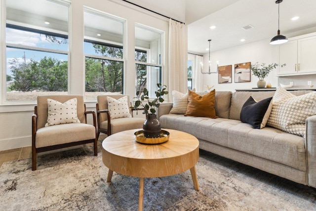 living room featuring recessed lighting, visible vents, and light wood-style flooring