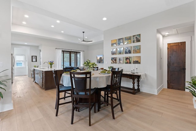 dining space featuring attic access, a ceiling fan, recessed lighting, and light wood-style flooring