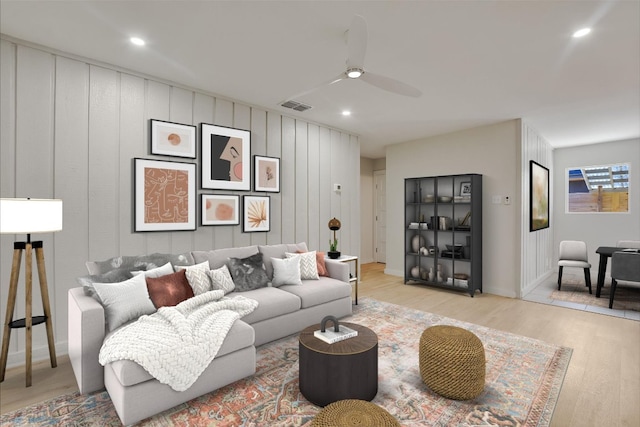 living room with ceiling fan, light wood-style flooring, recessed lighting, baseboards, and visible vents