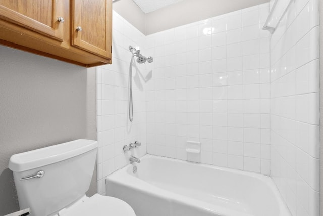 bathroom with shower / tub combination and toilet
