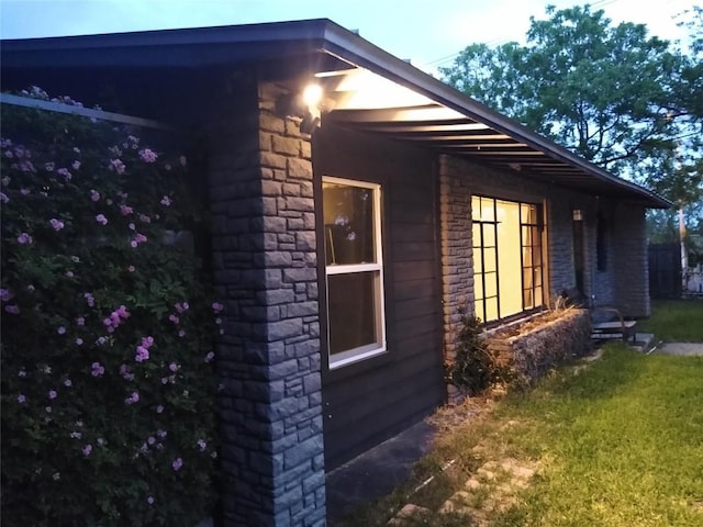 view of home's exterior featuring a yard