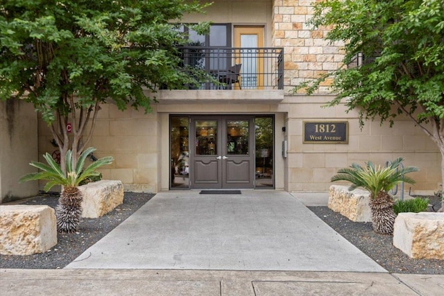 1812 W Ave Unit 306, Austin, TX 78701 - view of exterior entry featuring french doors and a balcony
