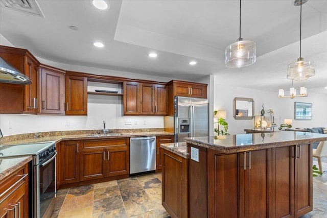 1812 W Ave Unit 306, Austin, TX 78701 - kitchen featuring stainless steel appliances, recessed lighting, a kitchen island, dark stone counters, and dark stone finish floors