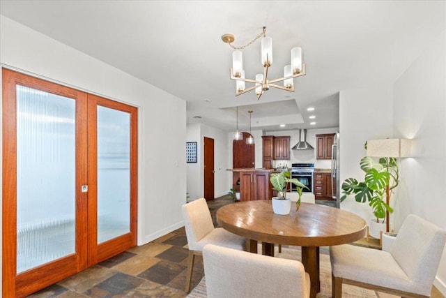 1812 W Ave Unit 306, Austin, TX 78701 - dining area featuring a chandelier and stone finish flooring