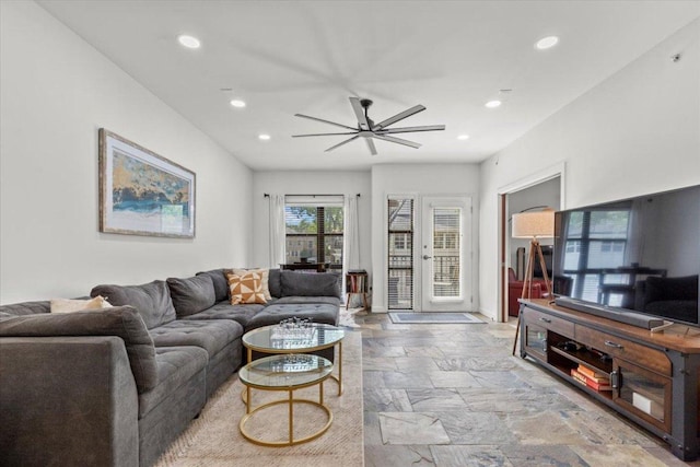 1812 W Ave Unit 306, Austin, TX 78701 - living room featuring stone tile flooring, a ceiling fan, and recessed lighting