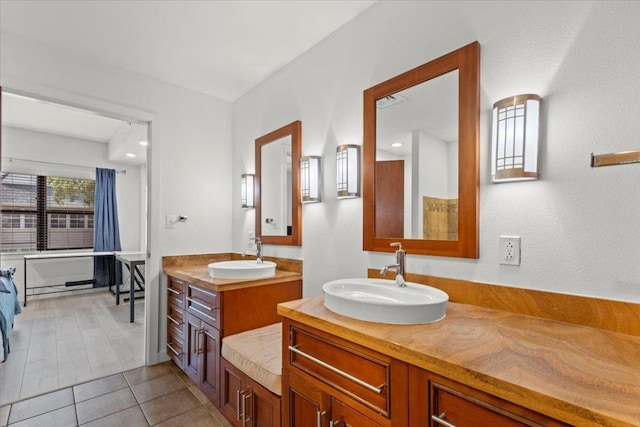 1812 W Ave Unit 306, Austin, TX 78701 - full bath featuring two vanities and tile patterned floors
