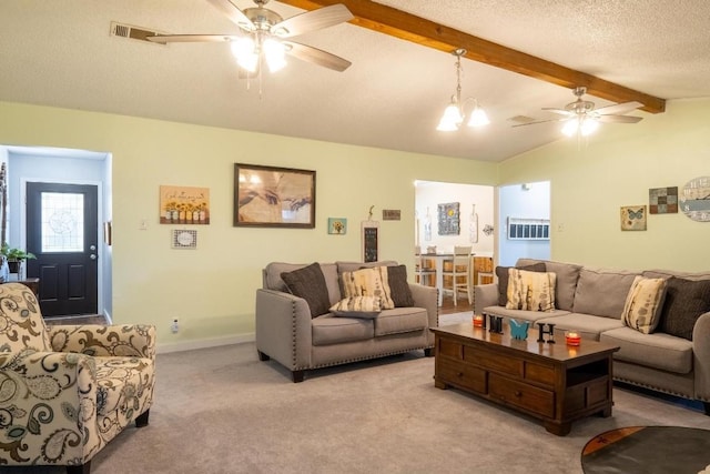 living area featuring lofted ceiling with beams, ceiling fan, carpet, and visible vents