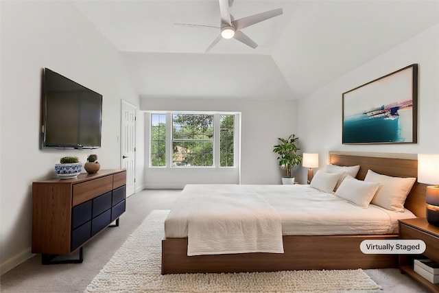 bedroom with a ceiling fan, light colored carpet, lofted ceiling, and baseboards