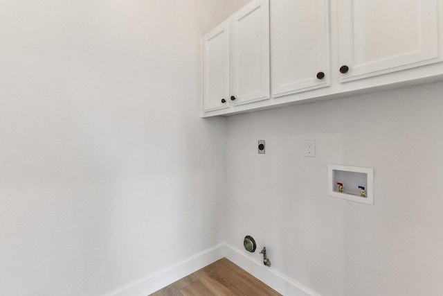 laundry room with gas dryer hookup, electric dryer hookup, baseboards, hookup for a washing machine, and cabinet space