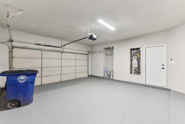 garage featuring a garage door opener and gas water heater