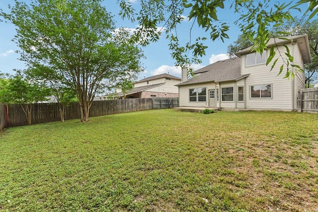 view of yard with a fenced backyard