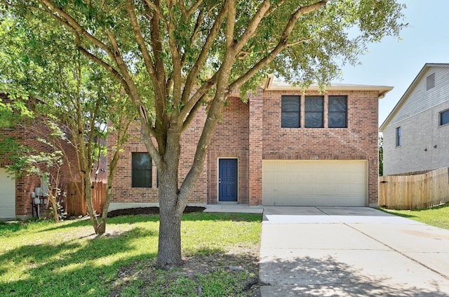 view of front of house with brick siding, fence, driveway, and an attached garage