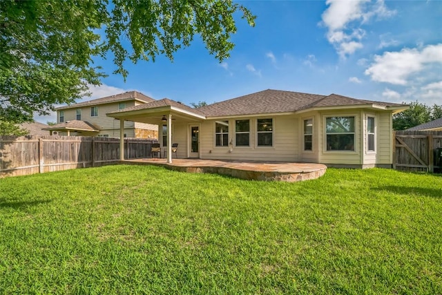 back of property featuring a patio, a fenced backyard, and a yard