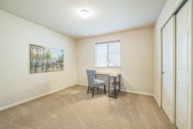 office with baseboards and carpet flooring