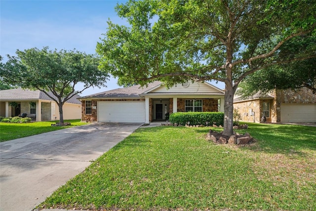 view of front of house with concrete driveway, a front lawn, and an attached garage