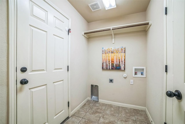 laundry room with laundry area, hookup for an electric dryer, gas dryer hookup, baseboards, and visible vents