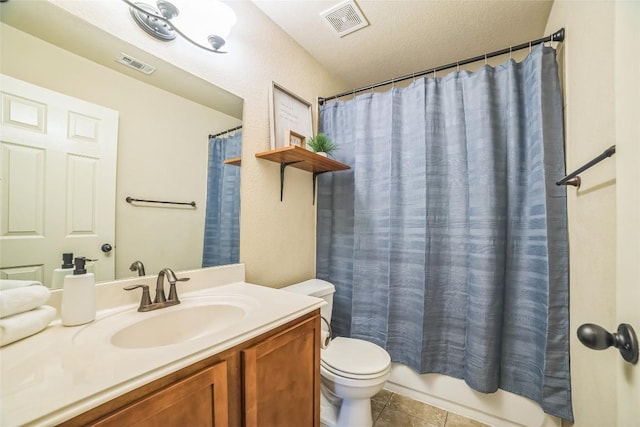 bathroom with visible vents, toilet, tile patterned flooring, and vanity
