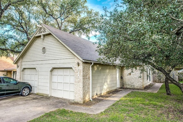 view of home's exterior featuring brick siding, driveway, an attached garage, and roof with shingles