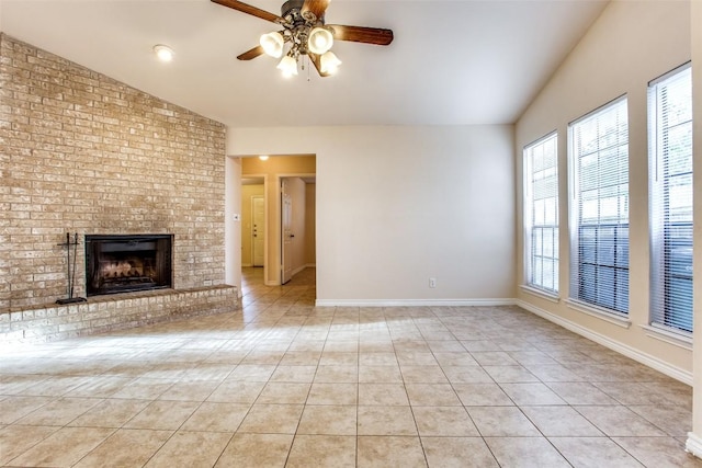 unfurnished living room featuring a fireplace, light tile patterned flooring, a ceiling fan, and vaulted ceiling