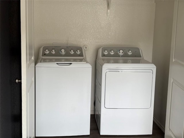 laundry area featuring independent washer and dryer and laundry area