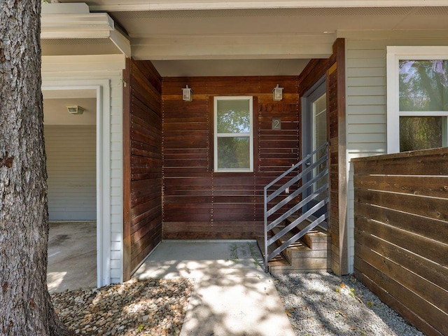 entrance to property featuring a porch