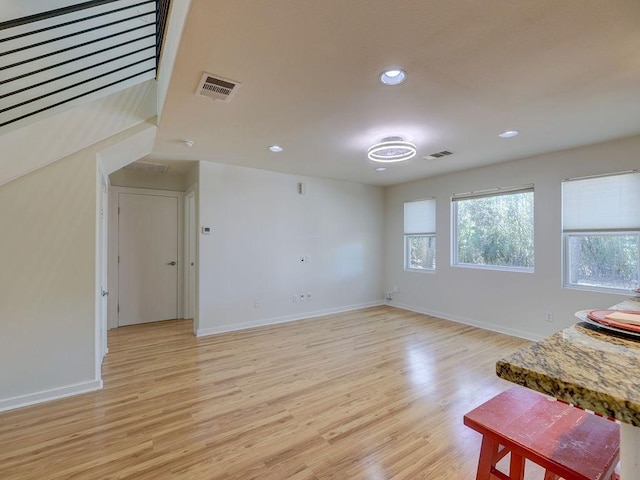400 E 33rd St Unit 2, Austin, TX 78705 - spare room with light wood-style flooring, baseboards, and recessed lighting