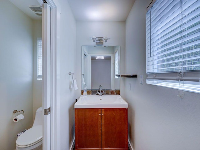 bathroom with vanity and toilet