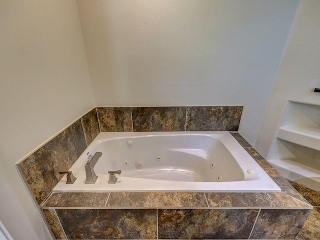 full bath featuring a tub with jets
