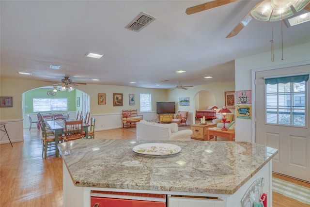 1833 Highland Dr, Marble Falls, TX 78654 - kitchen featuring ceiling fan, plenty of natural light, and visible vents