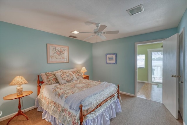 1833 Highland Dr, Marble Falls, TX 78654 - bedroom with a ceiling fan, visible vents, carpet, and baseboards