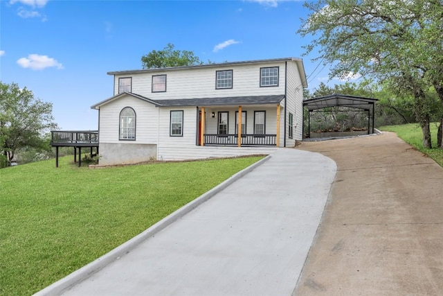 510 Circle Rd, Horseshoe Bay, TX 78657 - view of front facade featuring driveway, a porch, a front yard, and a carport