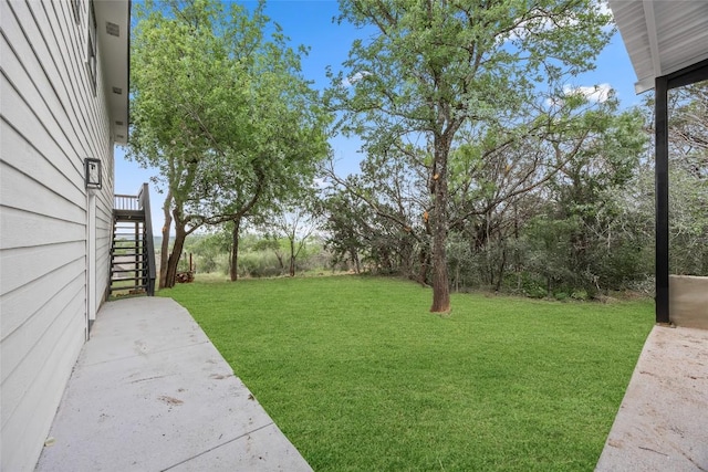 view of yard featuring stairway
