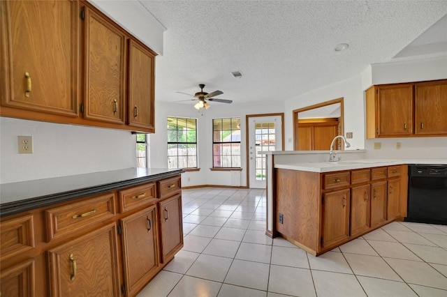 kitchen with light tile patterned floors, brown cabinets, ceiling fan, visible vents, and black dishwasher