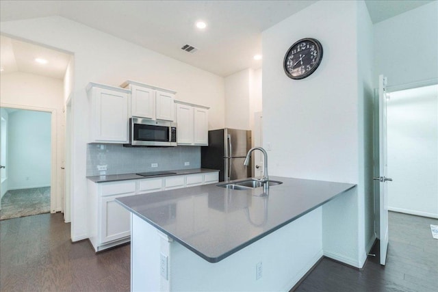 kitchen featuring appliances with stainless steel finishes, dark wood-style flooring, visible vents, and white cabinetry