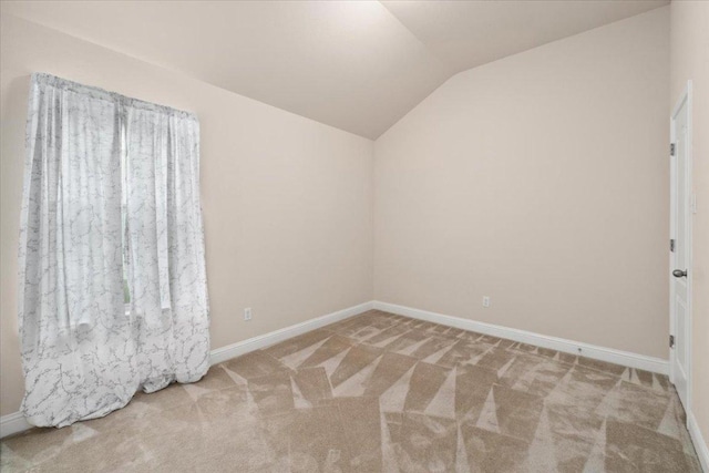231 Skinner, Kyle, TX 78640 - unfurnished room featuring vaulted ceiling, carpet flooring, and baseboards