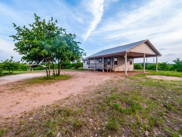 121 Hudson Rd, Smithville, TX 78957 - view of front of home with a metal roof